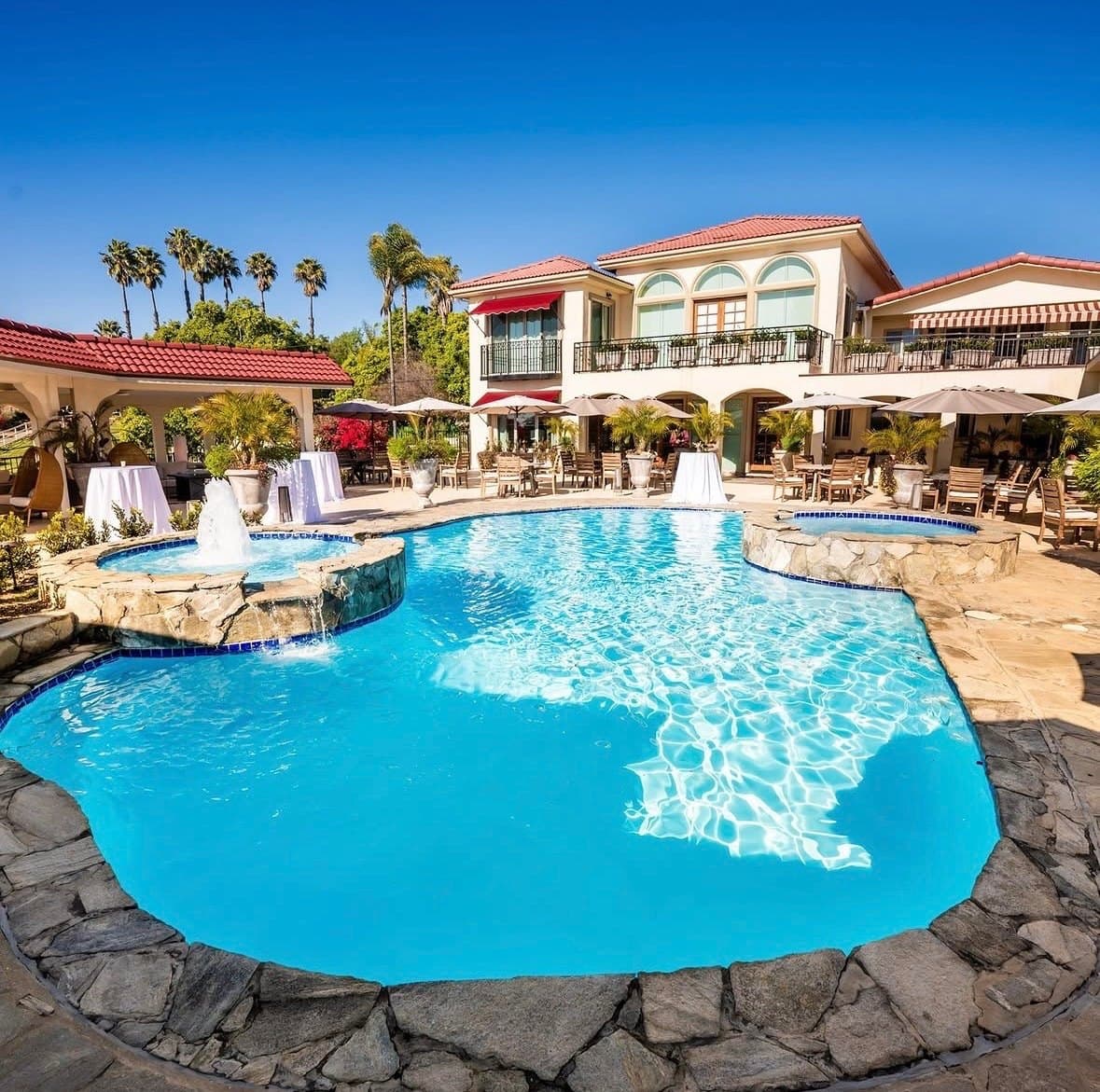 The estate's pool and terrace, with tables set out alongside