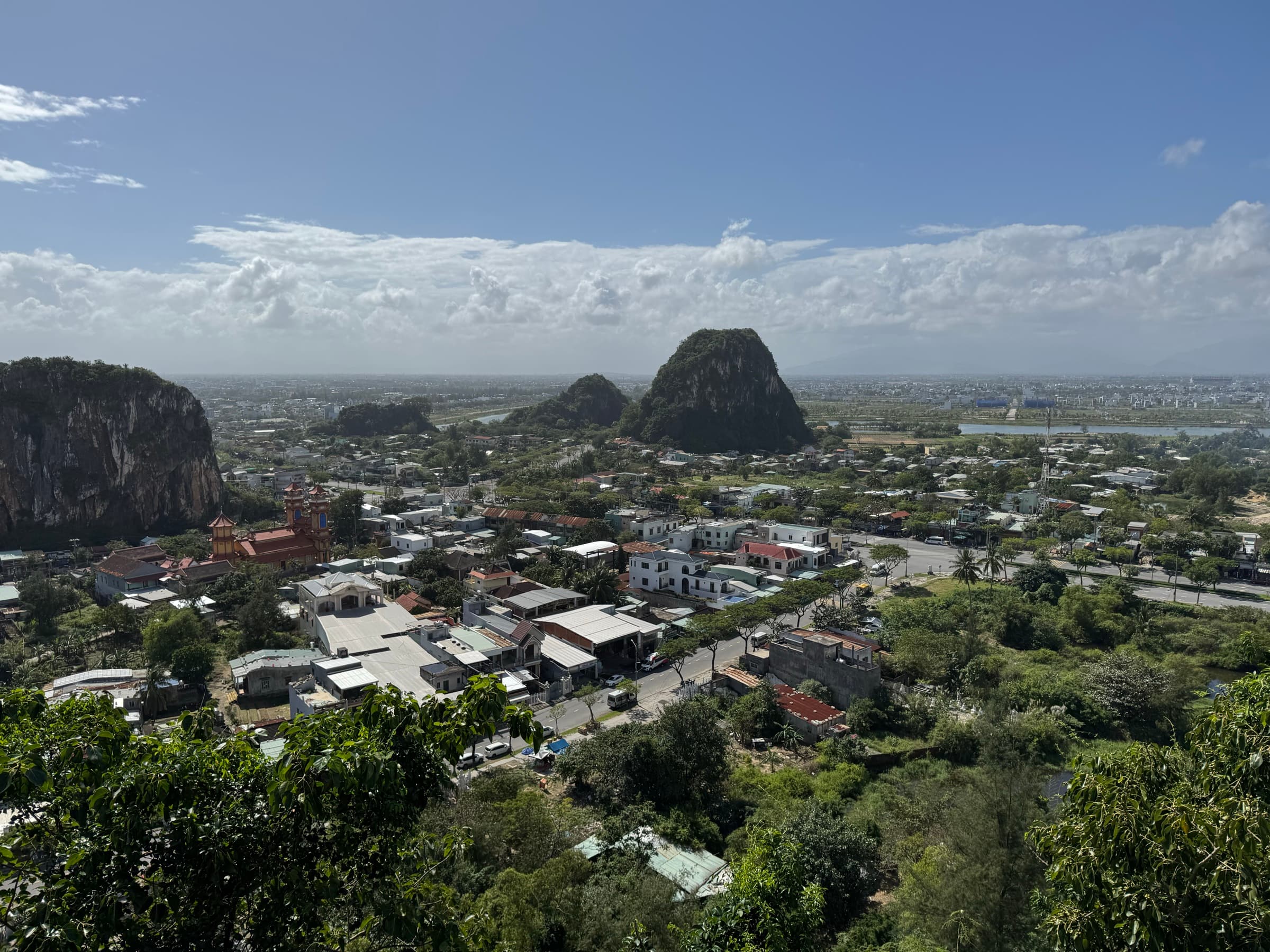 A panoramic view over Da Nang from the Marble Mountains, with the Marble Mountain karst peaks in the foreground